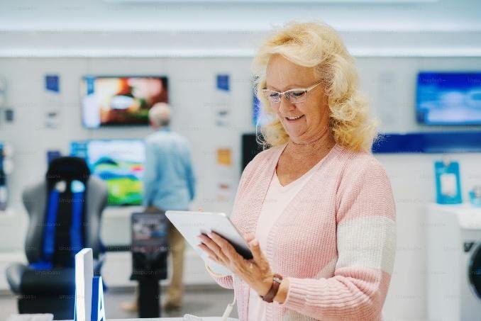 A woman shopping at an electronics store in Fresno