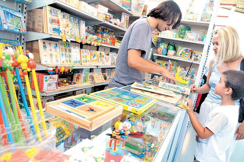 Family browsing educational products at a toy store in California