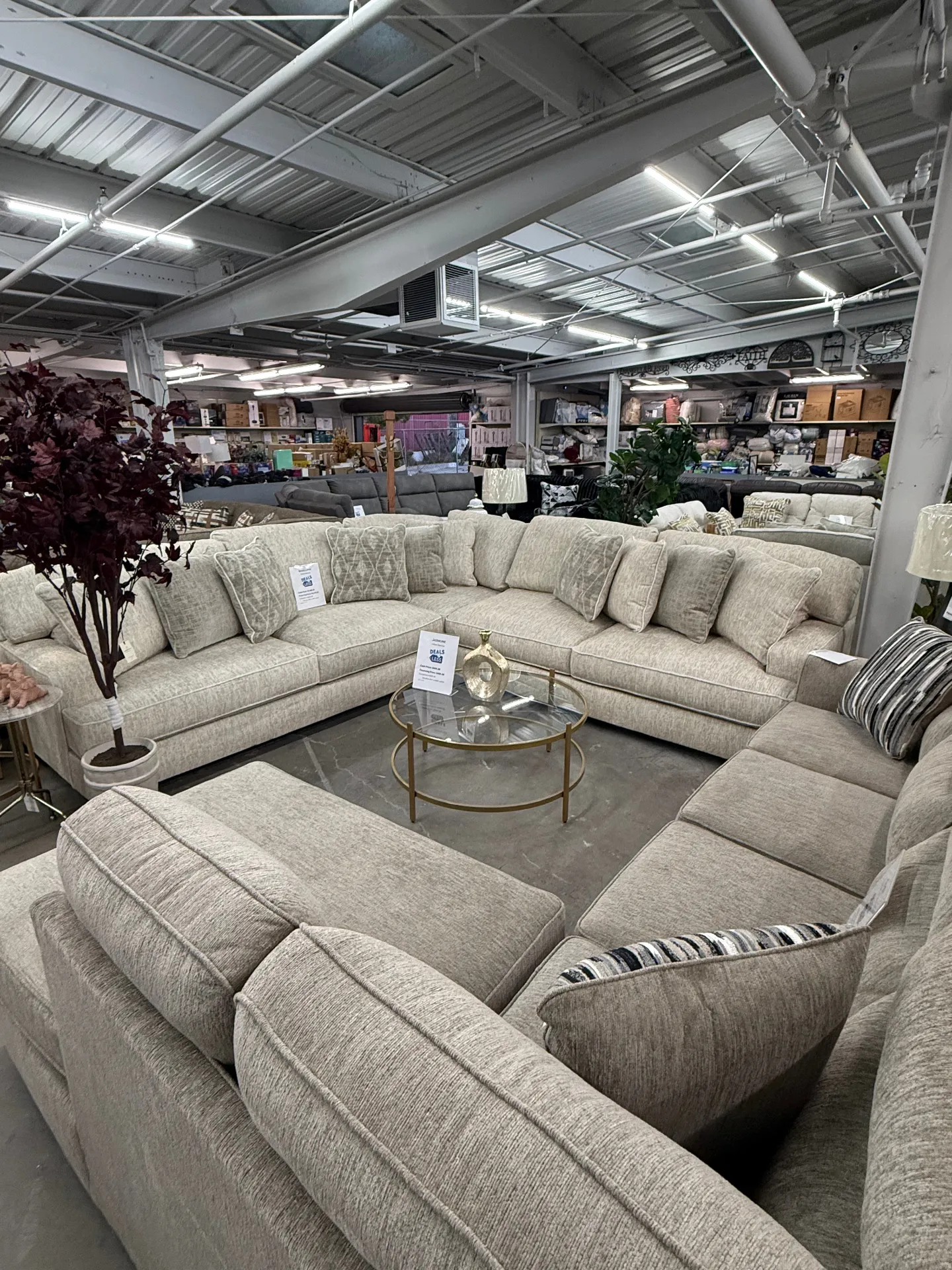 Large cream sectional sofa set with coffee table at Deals4Less Spruce