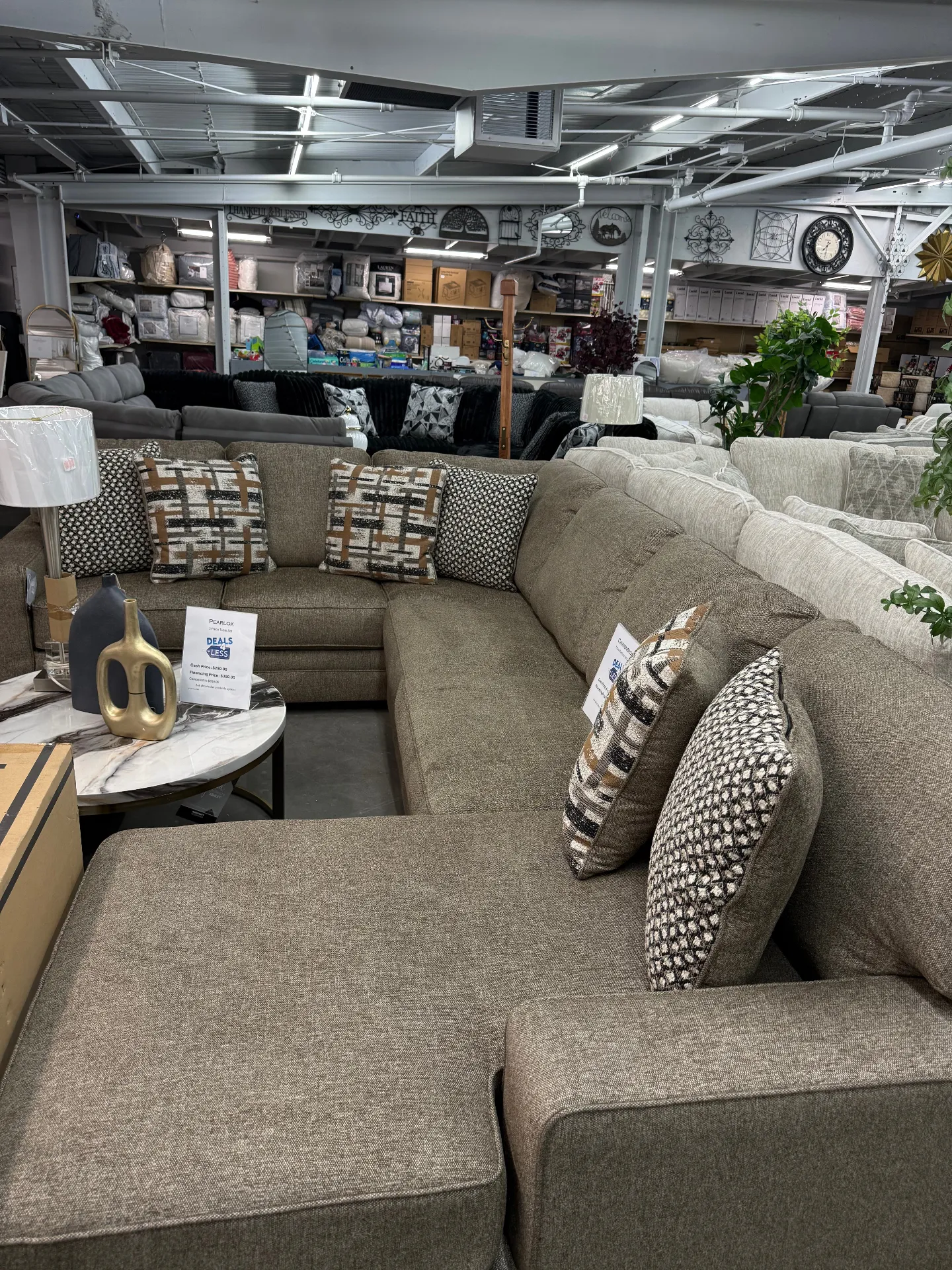 Brown Pearlox sectional with accent pillows at Deals4Less Spruce