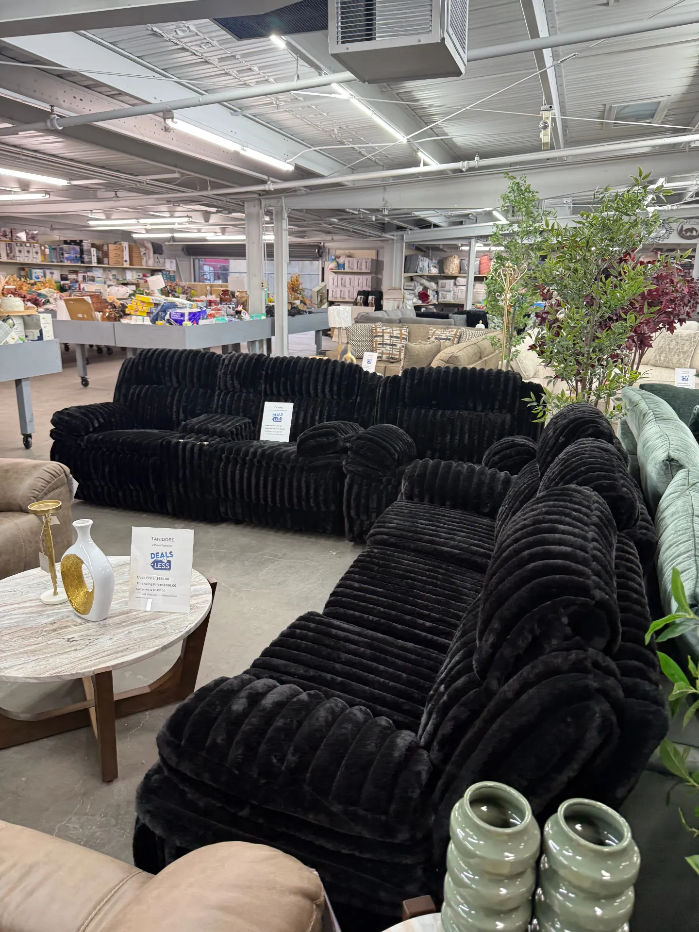 Black plush channel-tufted sectionals at Deals4Less Spruce