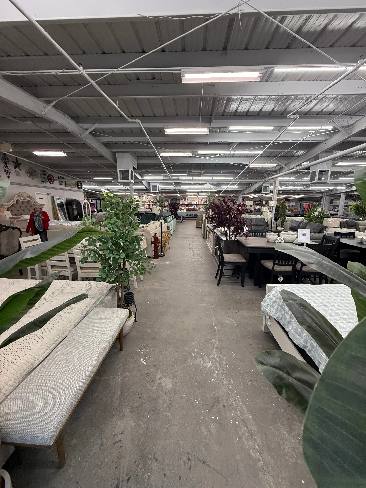 Wide showroom view of the new Spruce location floor at Deals4Less Spruce