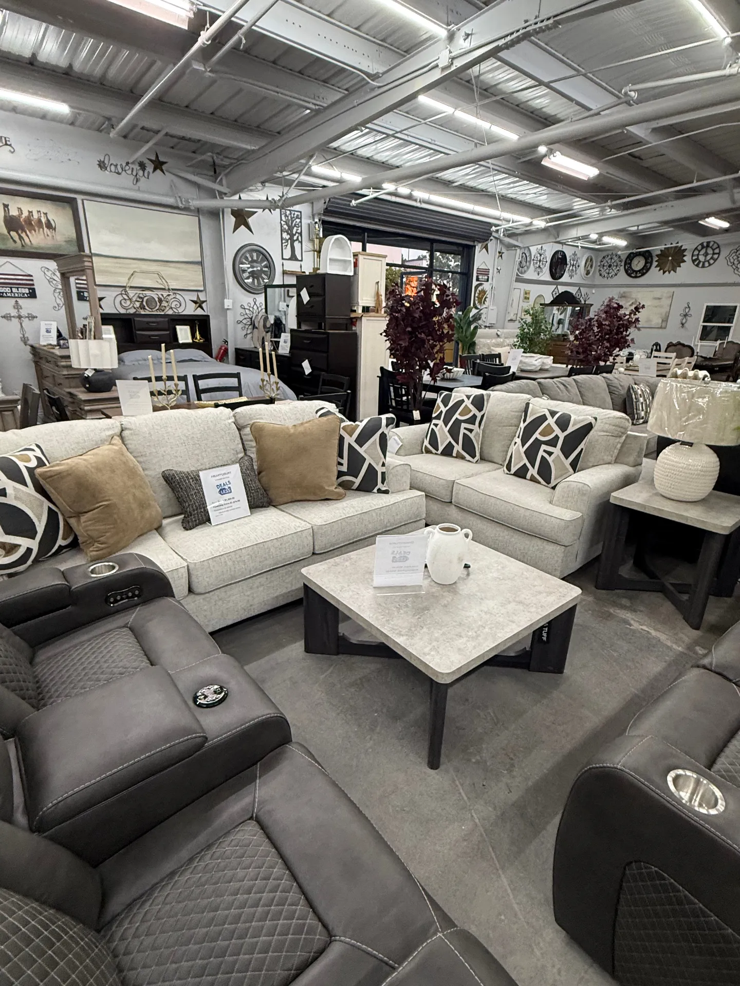 Living room showroom with sofas and recliners at Deals4Less Spruce